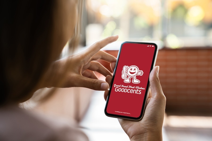phone in woman hand showing Goodcents app